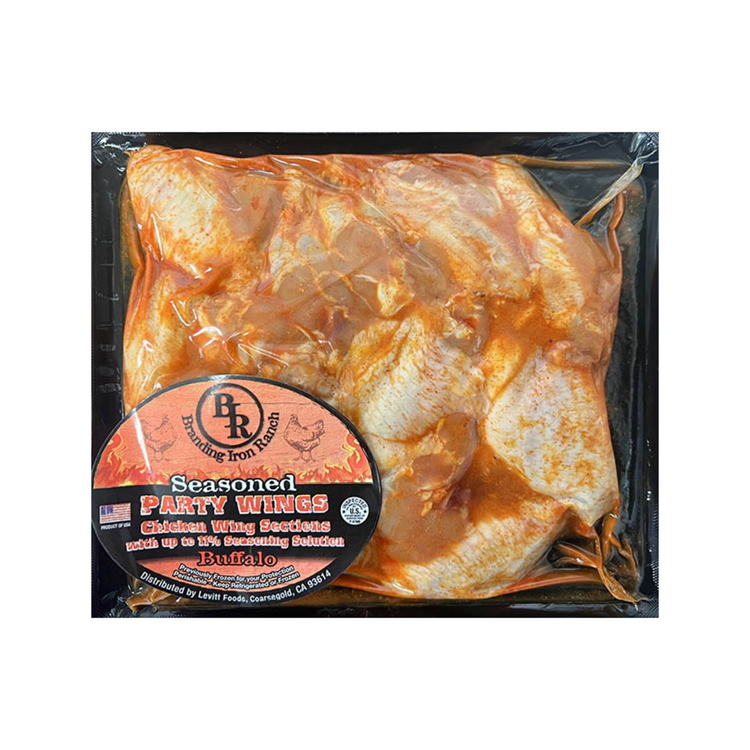 Seasoned Buffalo chicken wing sections in packaging.